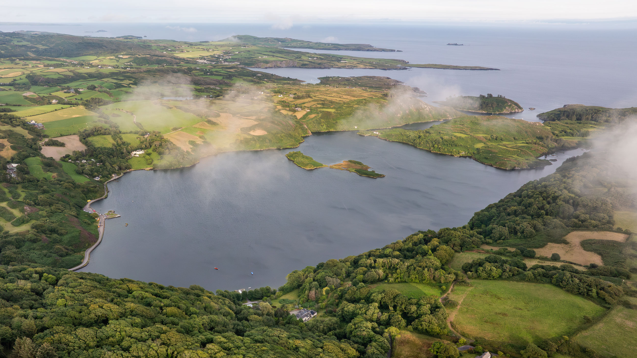Coastal and oceanic landforms, Water resources, Natural landscape, Cloud, Sky, Highland, Vegetation, Watercourse, Lake